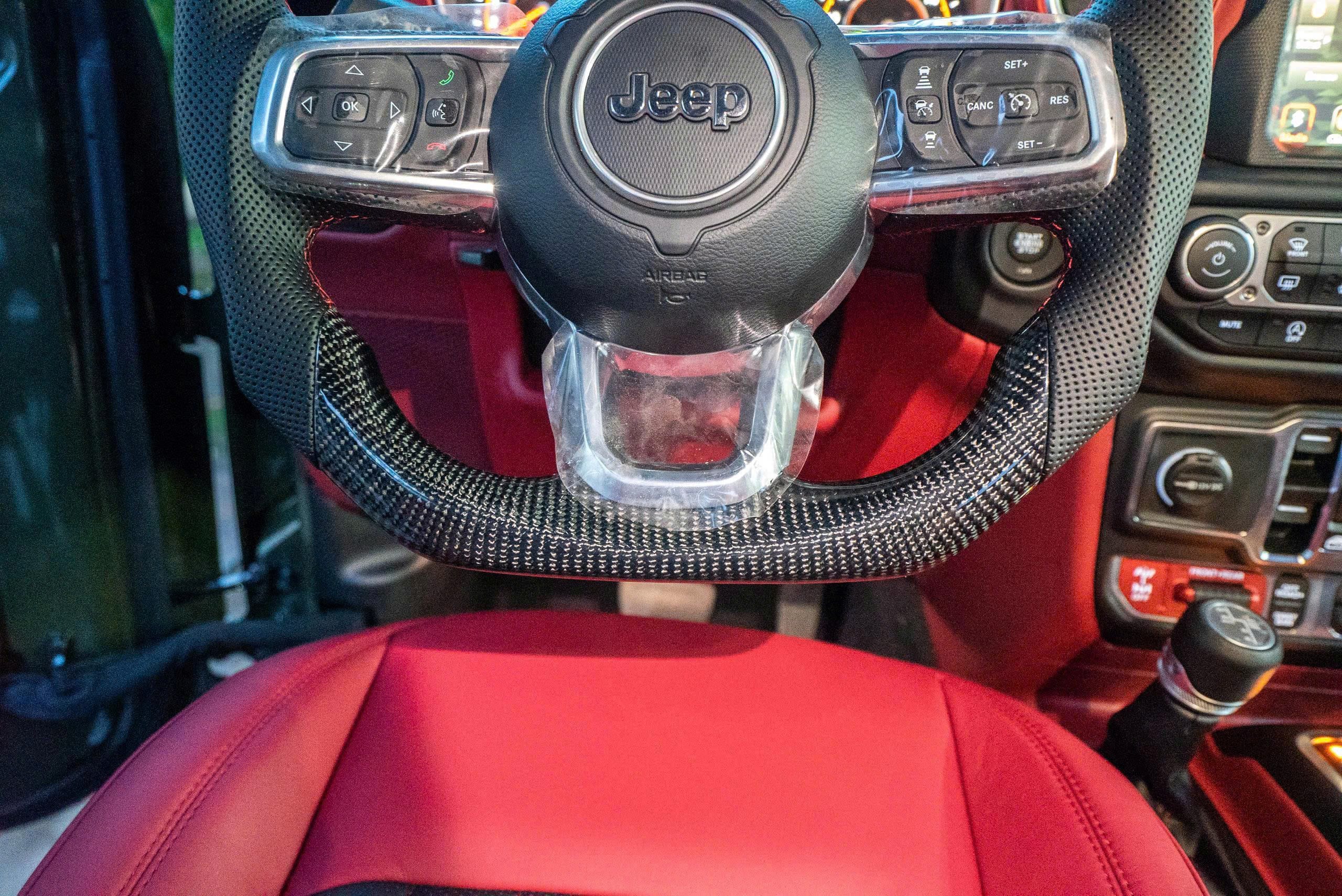 May da - khâu da- bọc da vô lăng xe Jeep